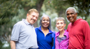 Retirees smiling outdoors