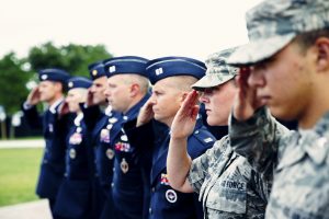 UCF Students in U.S. Military Uniforms Saluting the U.S. Flag